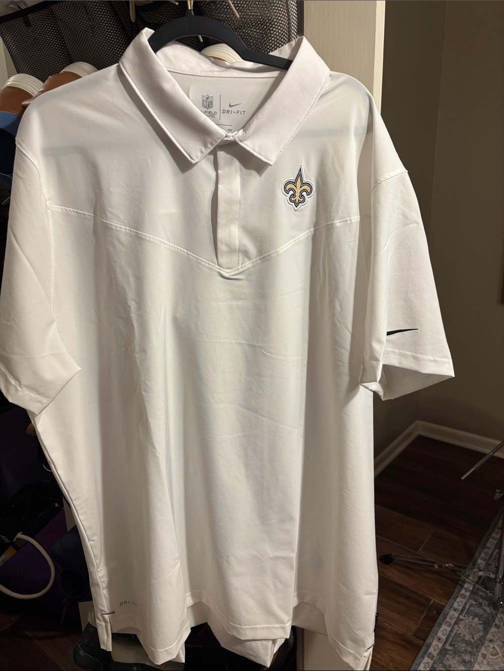Nike White Men’s Dri fit polo with New Orleans Saints Fleur-de-lis